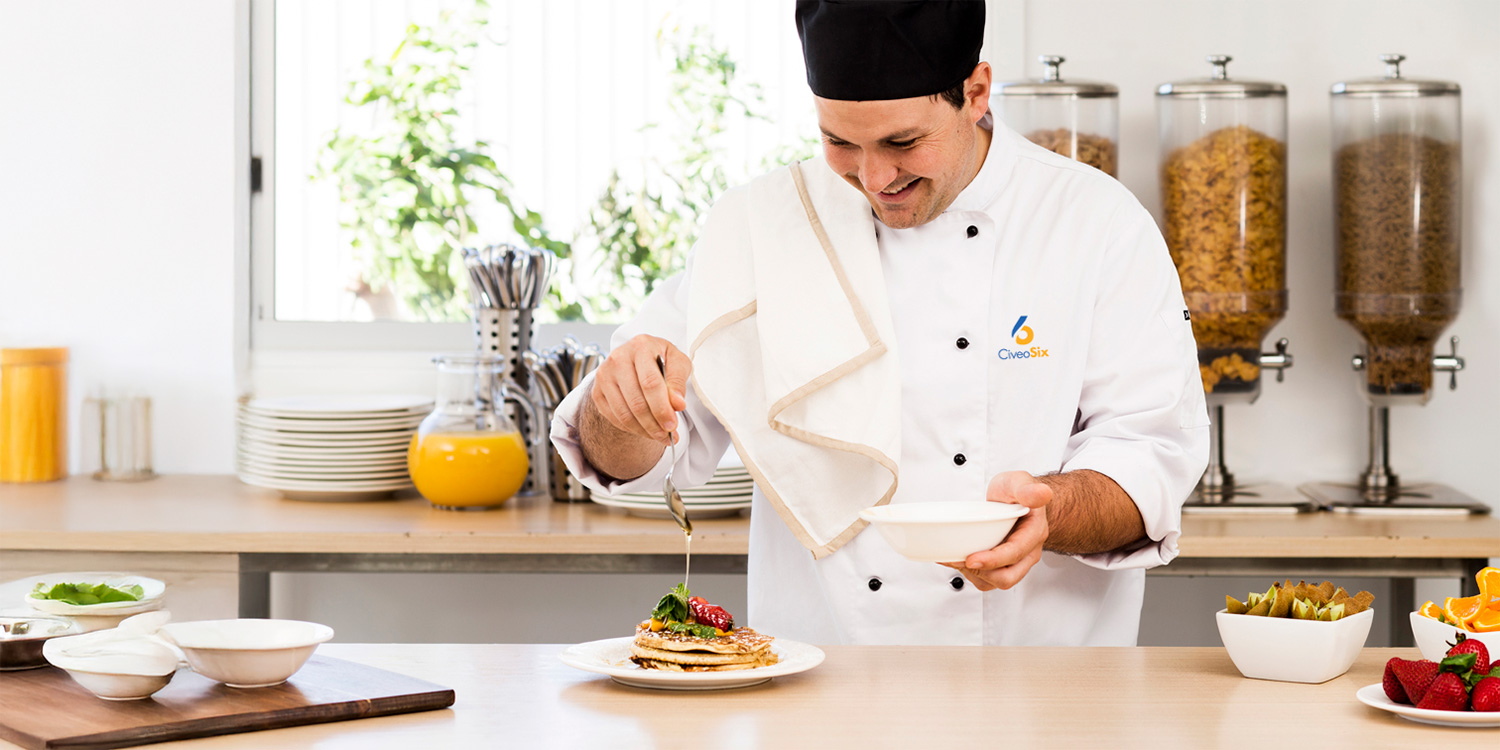 Chef preparing a plate of pancakes