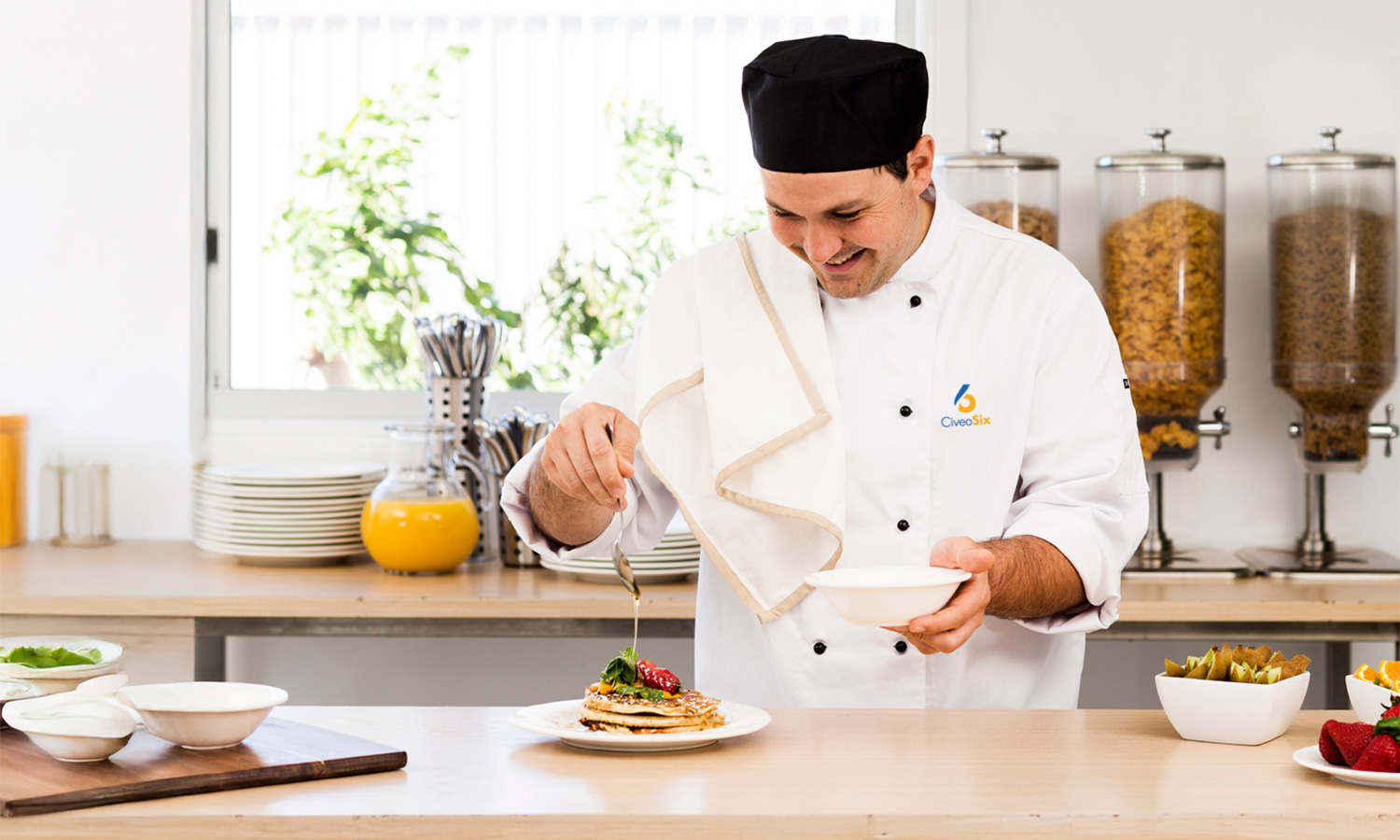 Chef preparing a plate of pancakes